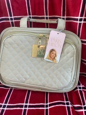 Paris Hilton Quilted Cream Travel Toiletry hanging bag with Gold Tag